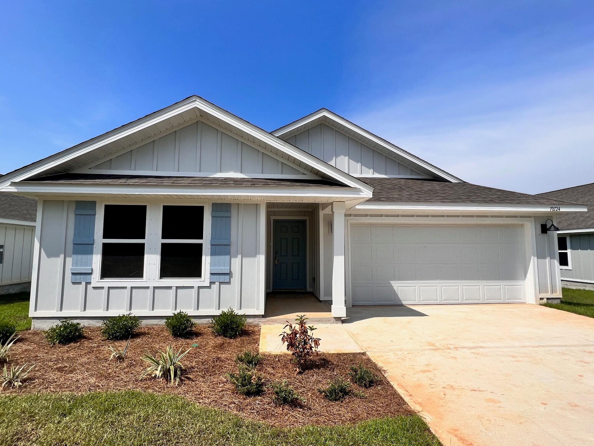 a front view of a house with yard