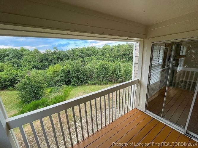 a view of balcony with yard