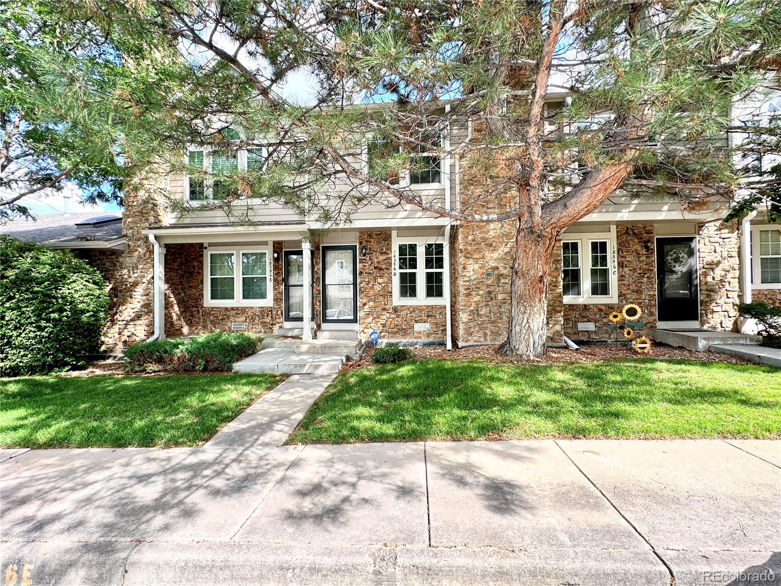 a view of a house with a yard