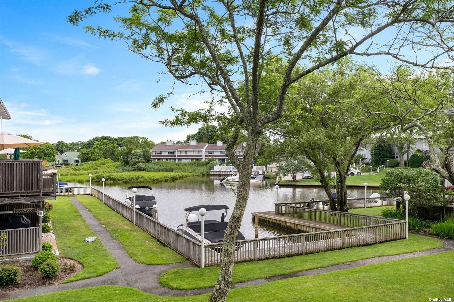 a view of a lake with a garden and deck