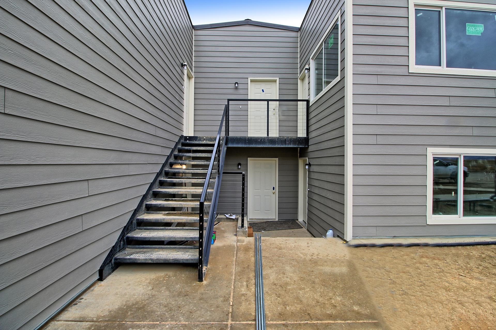 a view of a house with wooden stairs