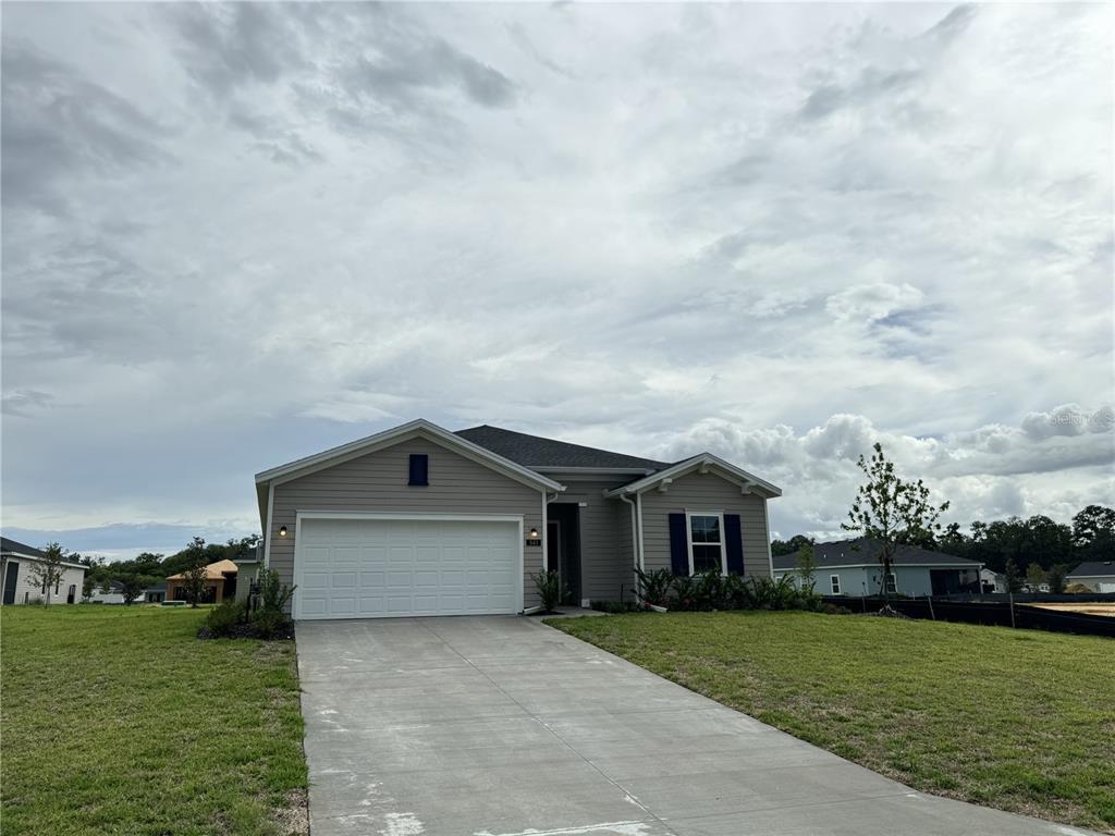 a house with yard in front of it