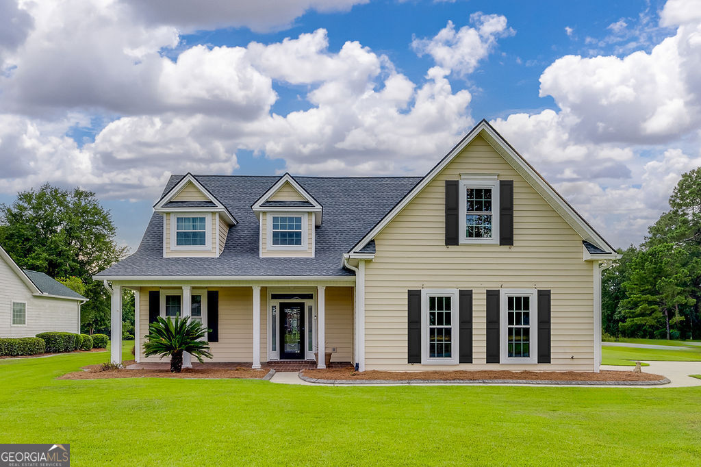 a front view of a house with a yard