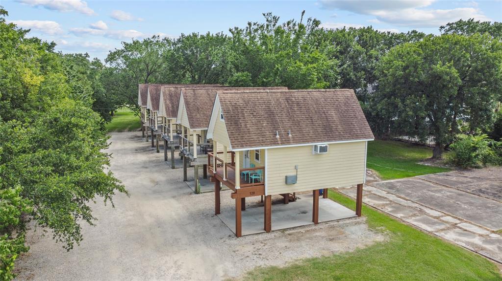 an aerial view of a house having patio with a yard