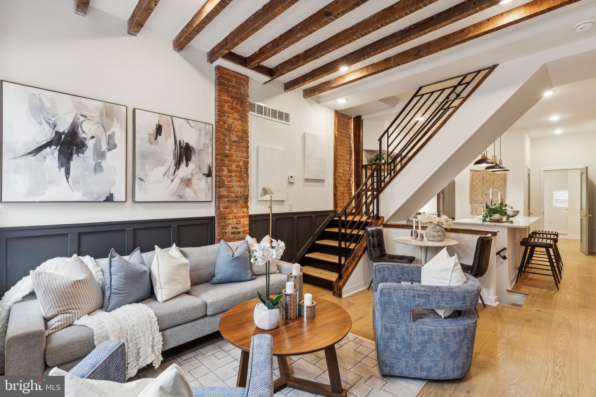 a living room with furniture and a painting