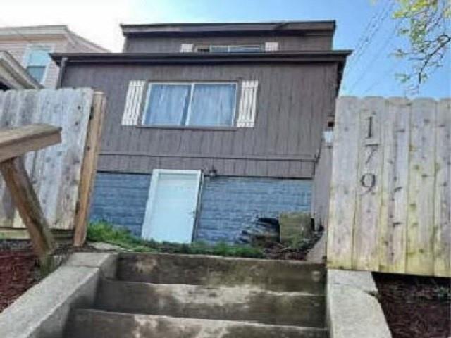 a front view of a house with parking space