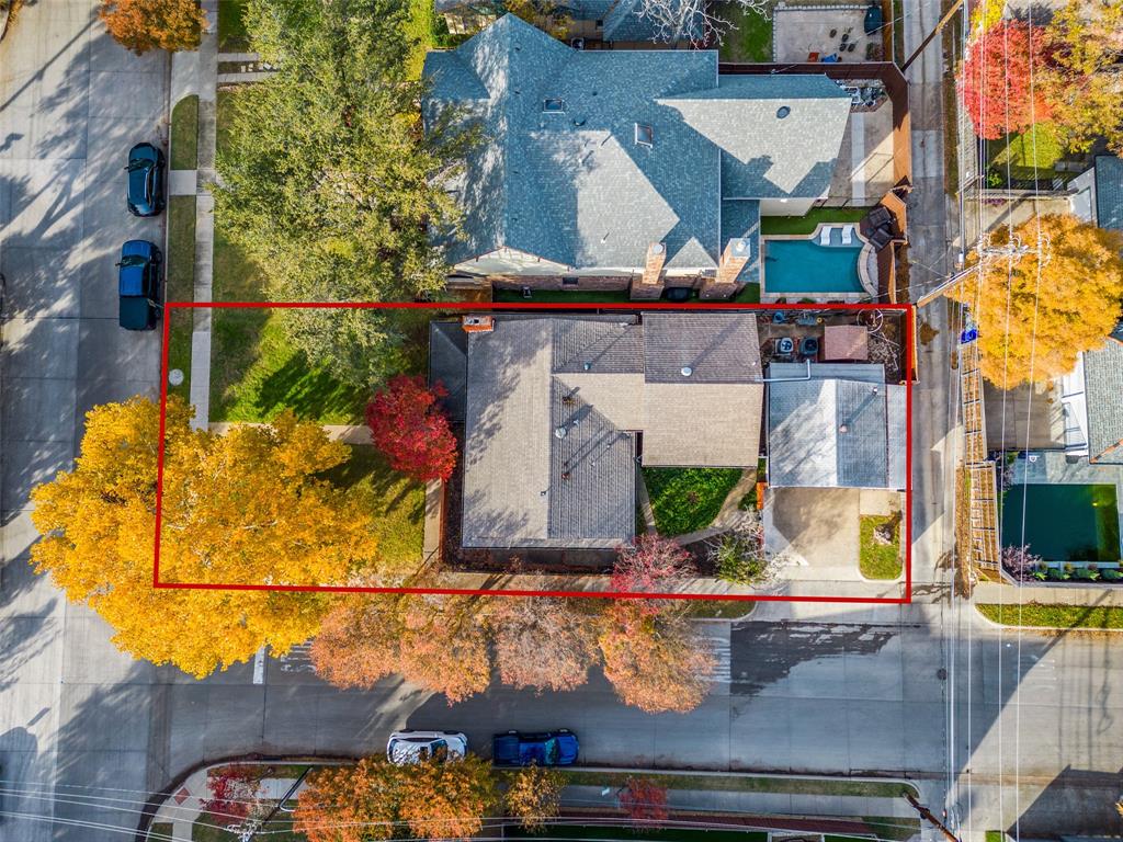 an aerial view of a houses with yard