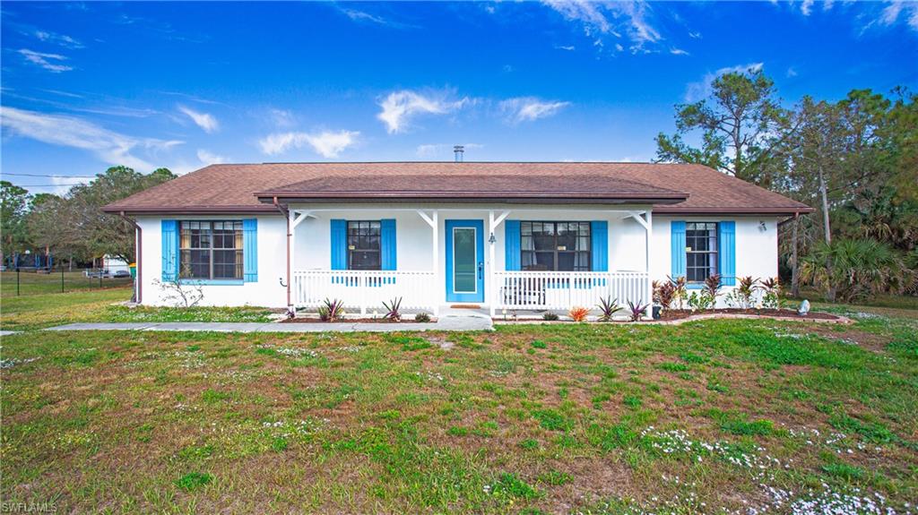 Ranch-style house featuring a front porch