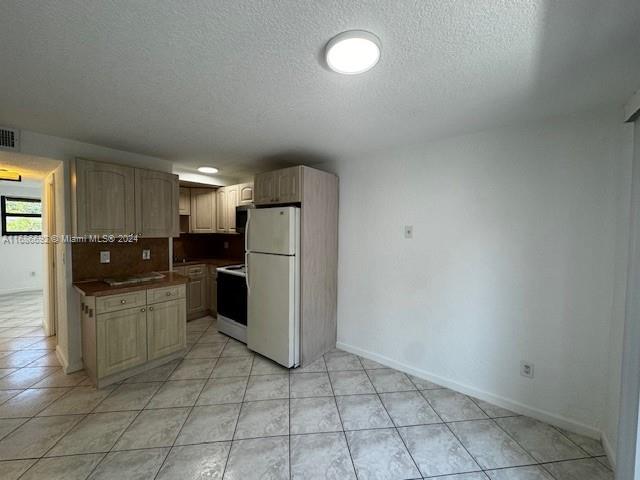 a kitchen with a cabinets and steel appliances