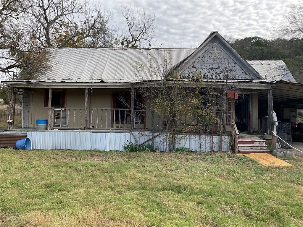 a view of a house with a sink and yard