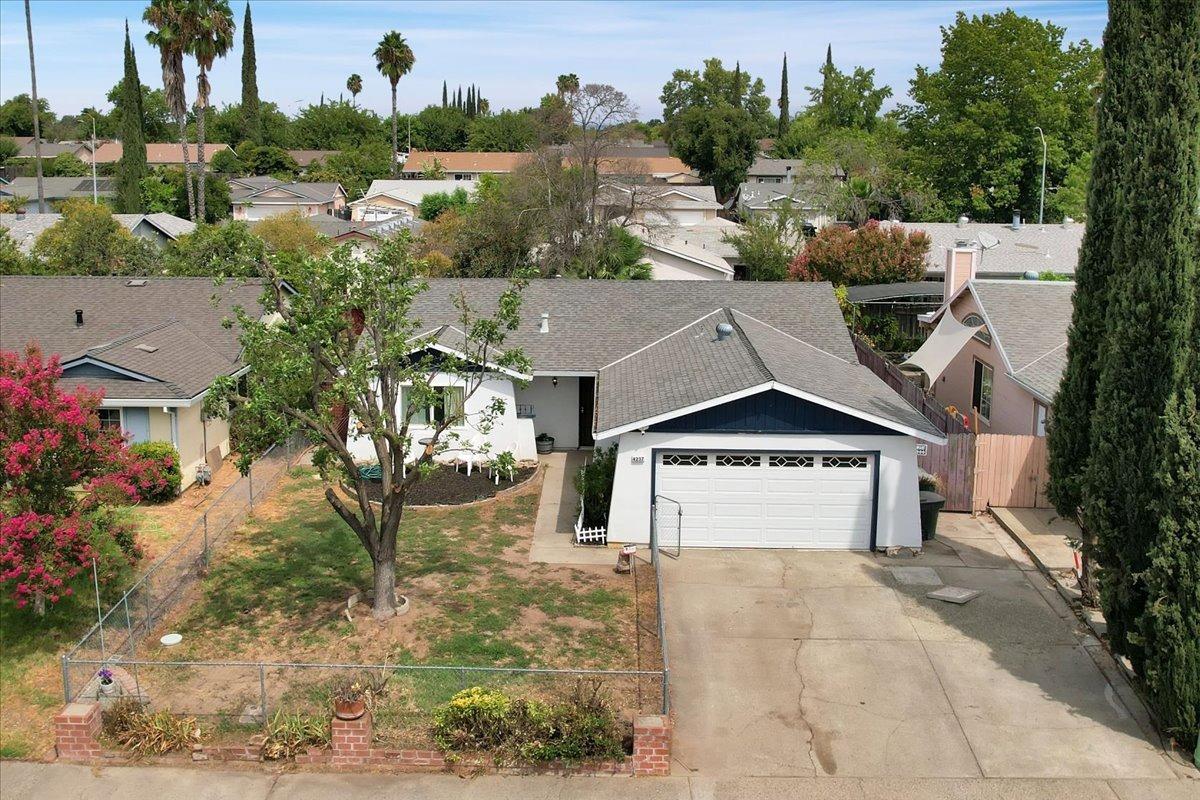 an aerial view of a house with a yard