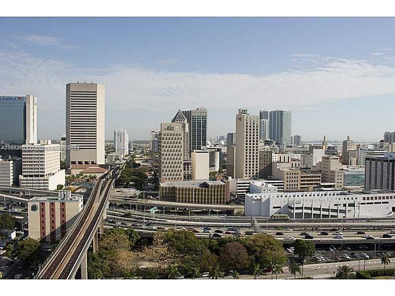 a view of a city with tall buildings