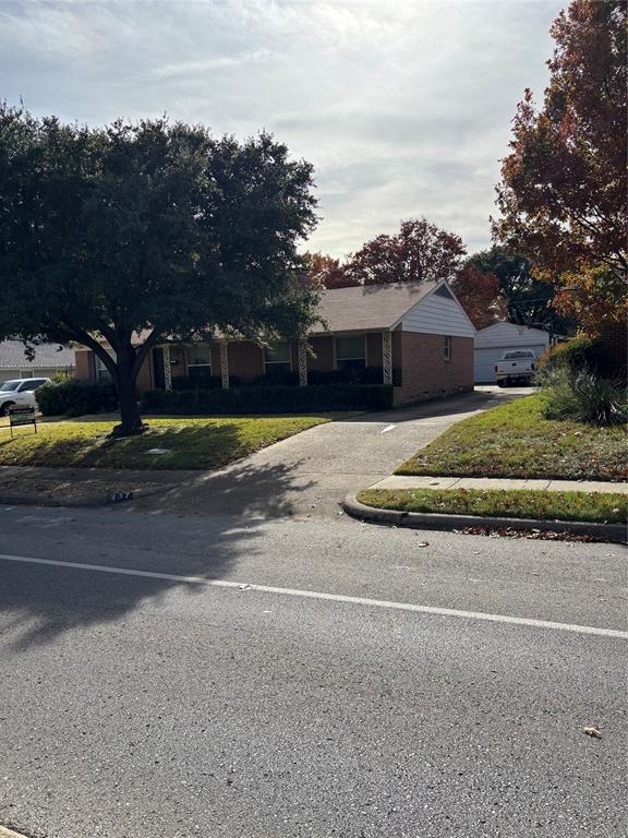 a view of a house with a street