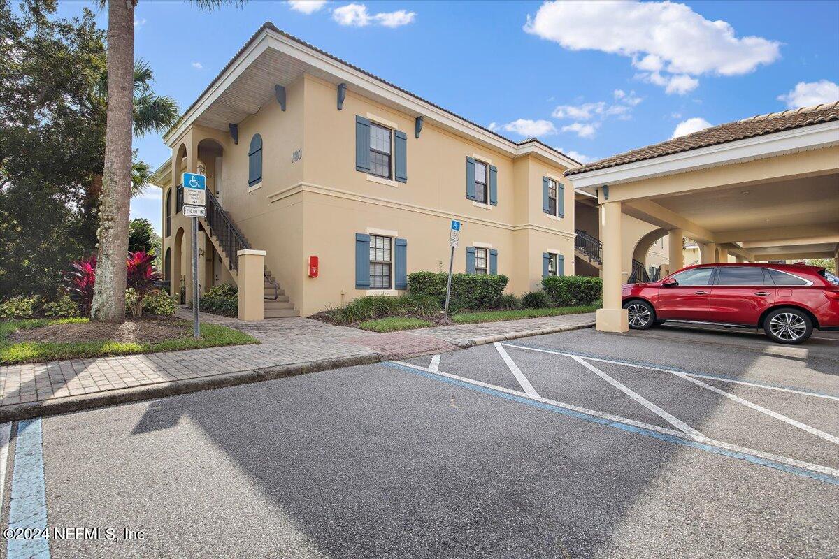 a view of a car park in front of house