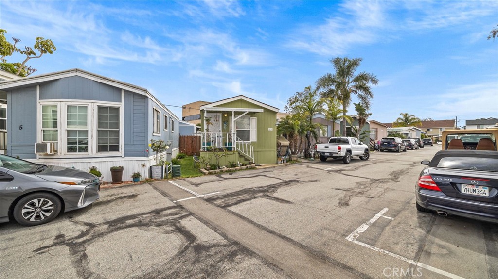 a view of a car parked in front of a house