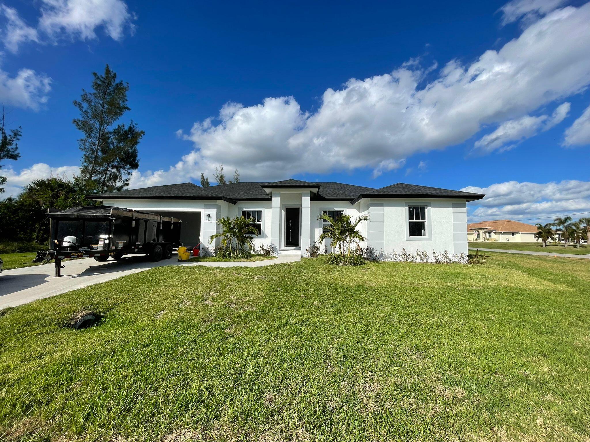 a front view of house with yard and seating area