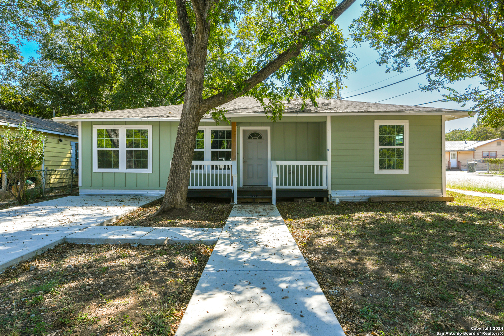 a house with trees in front of it