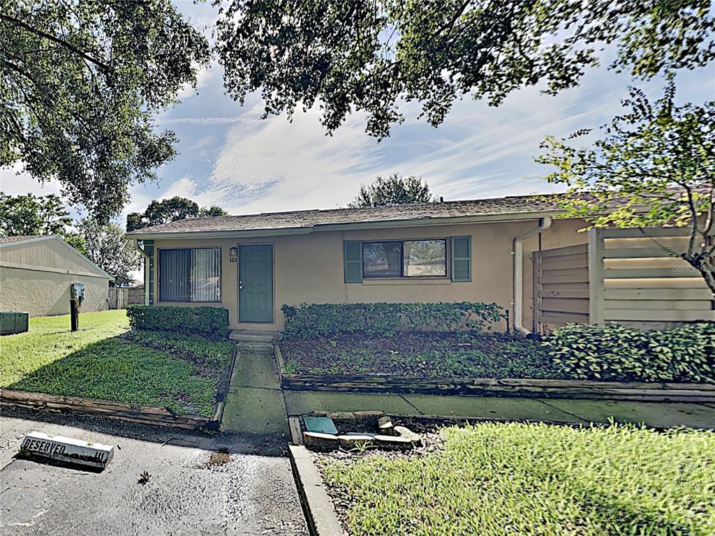 front view of a house with a garden