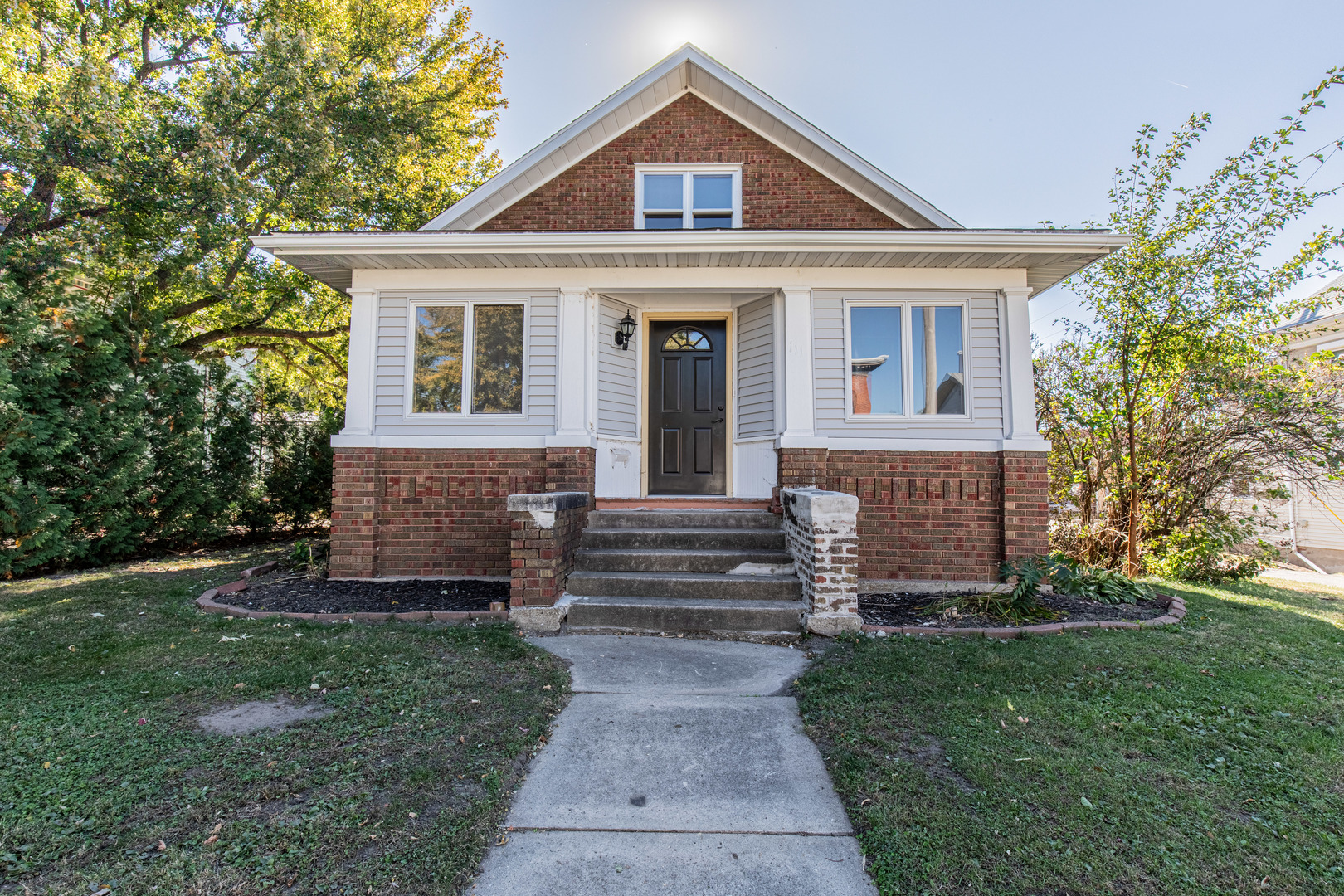 front view of a house with a yard