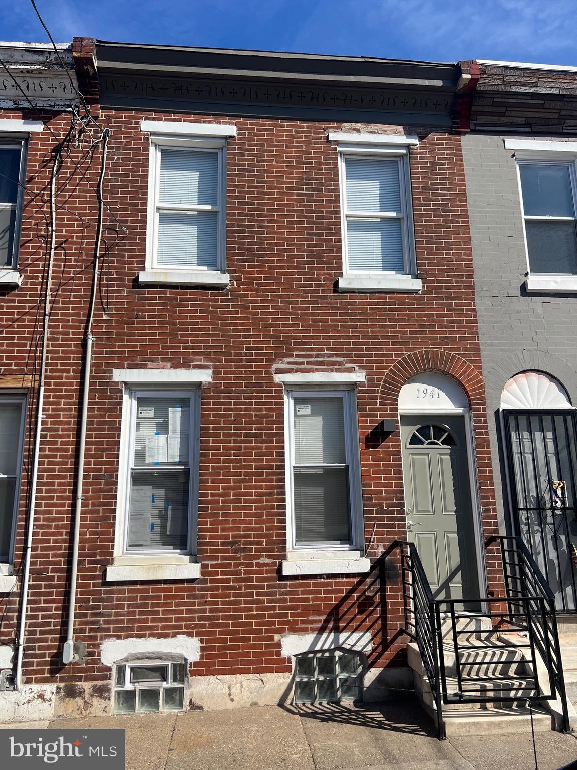 a front view of a house with parking