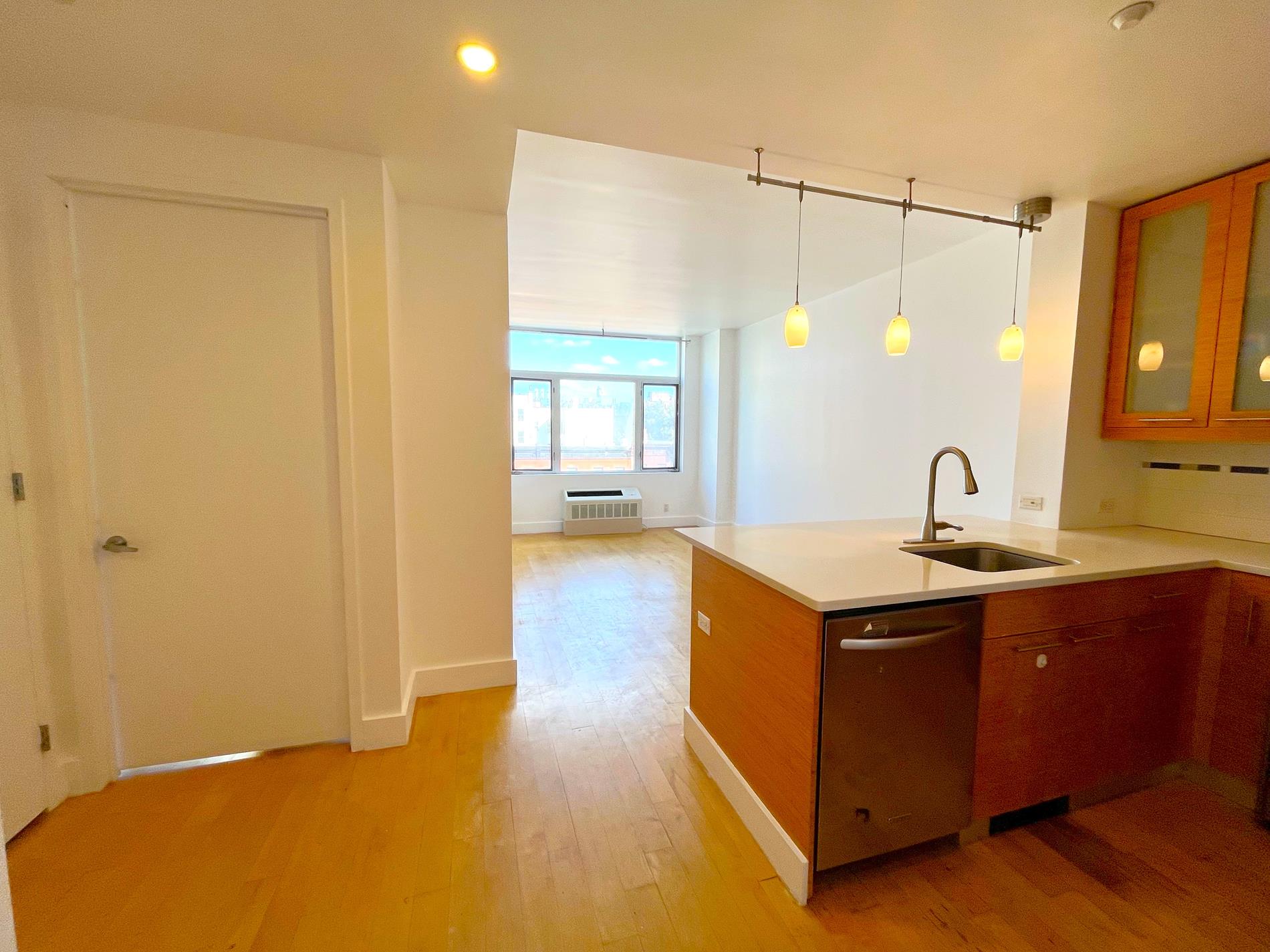 a kitchen with a sink and cabinets