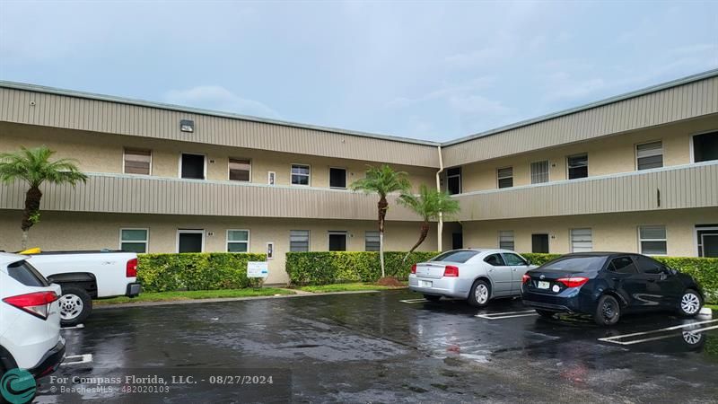 a view of a car park in front of house