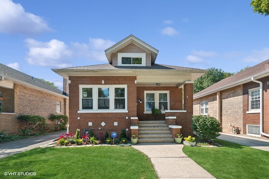 front view of a house with a yard