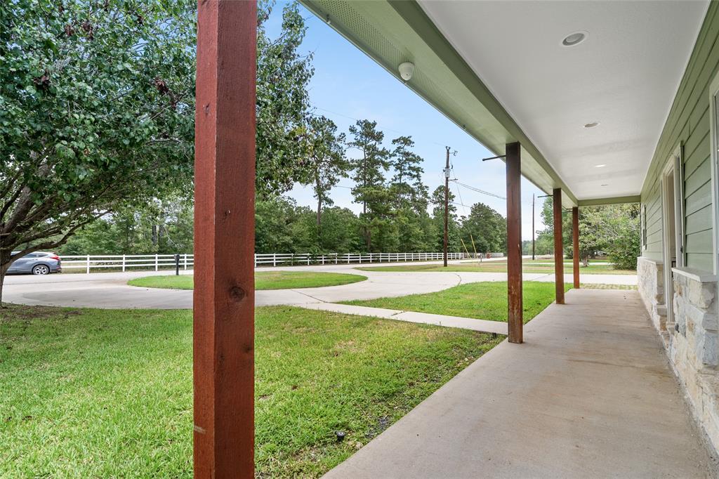 Relax on your beautiful porch across the front of the house