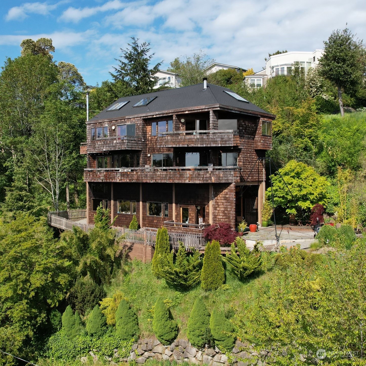 an aerial view of a house with yard porch and furniture