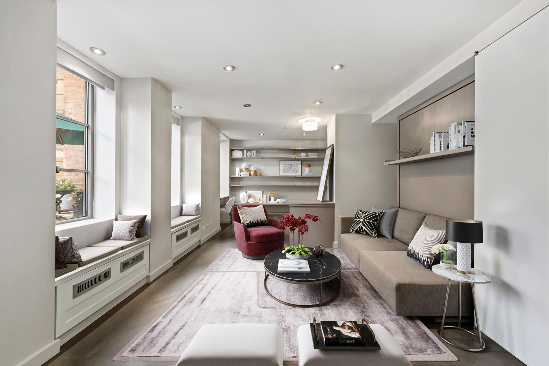 a living room with furniture and a potted plant