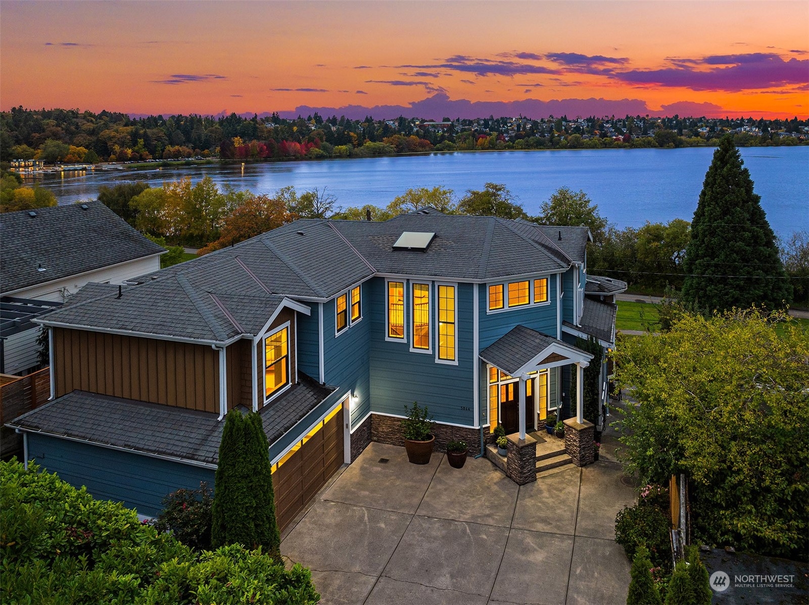 a view of a house with outdoor space and lake view