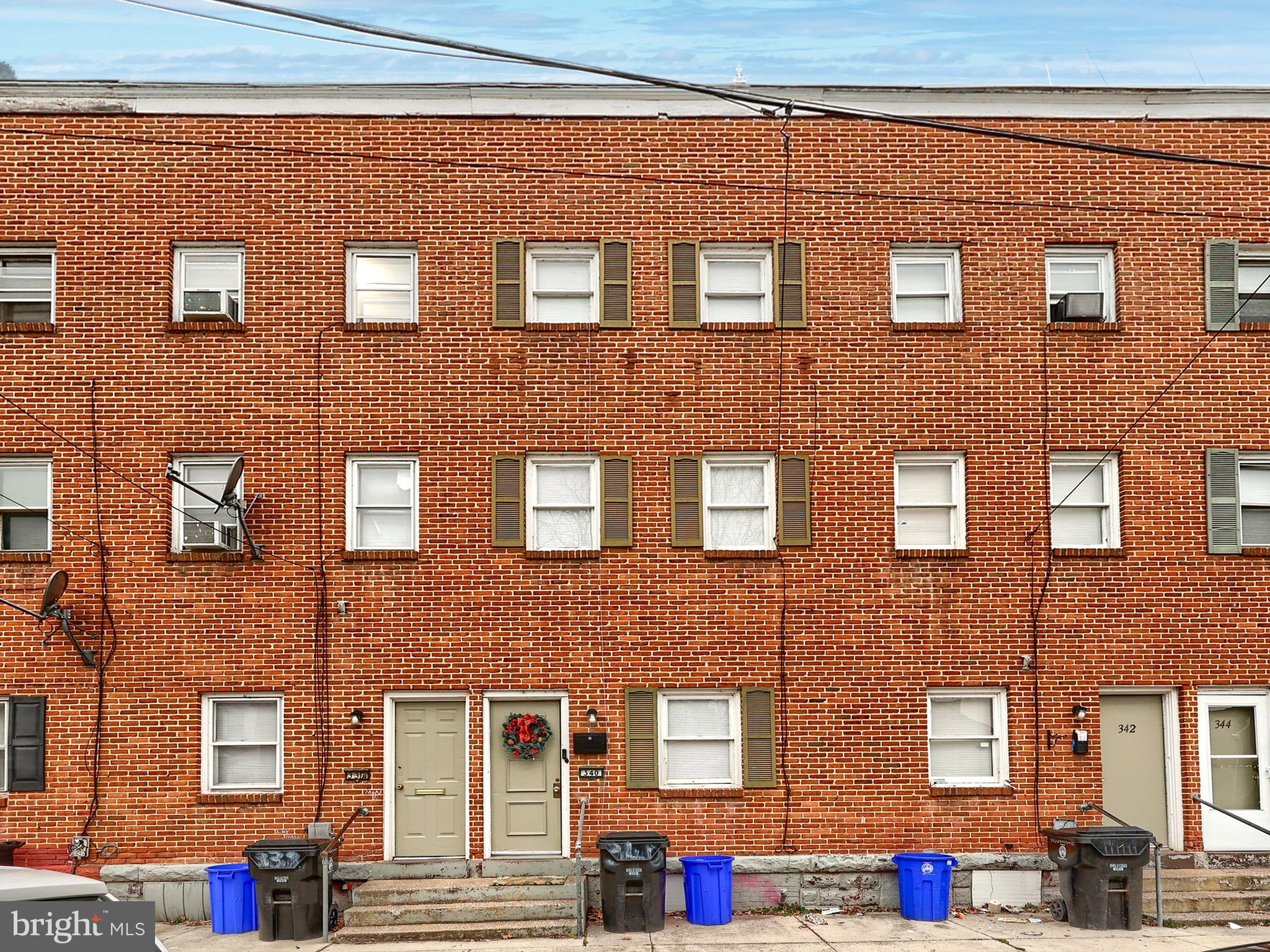 a front view of a building with many windows