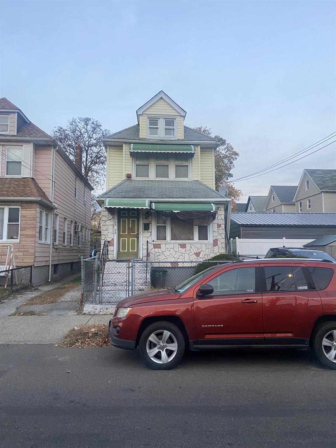 a car parked in front of a house