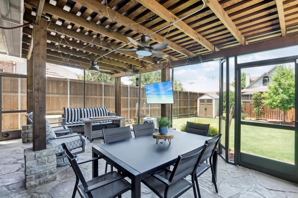 a view of a patio with a table chairs and a table