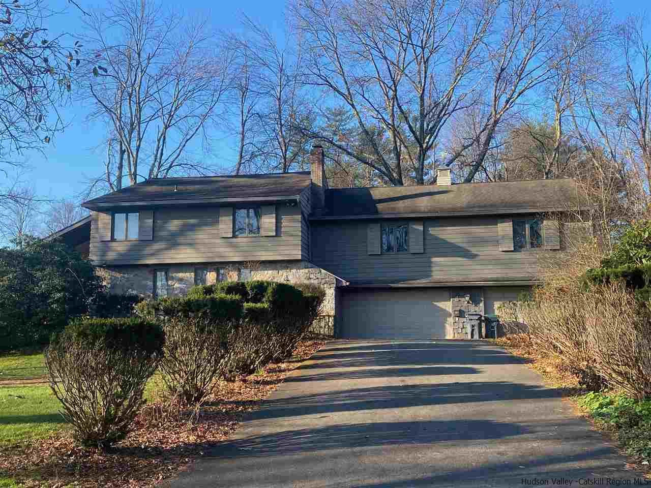 a front view of a house with garage