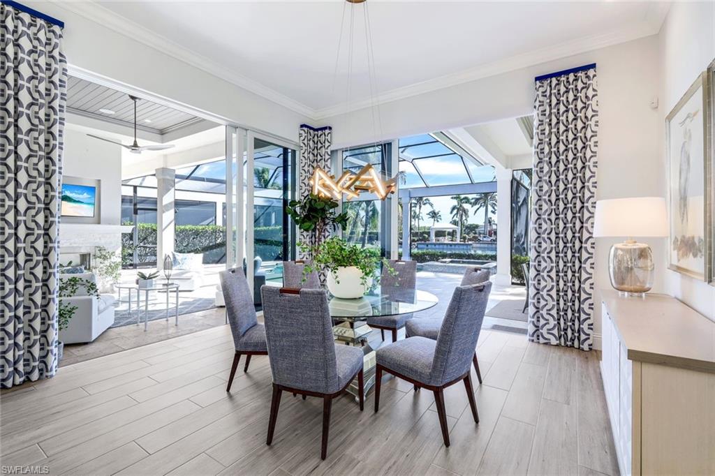 Dining area open to the pool oasis!