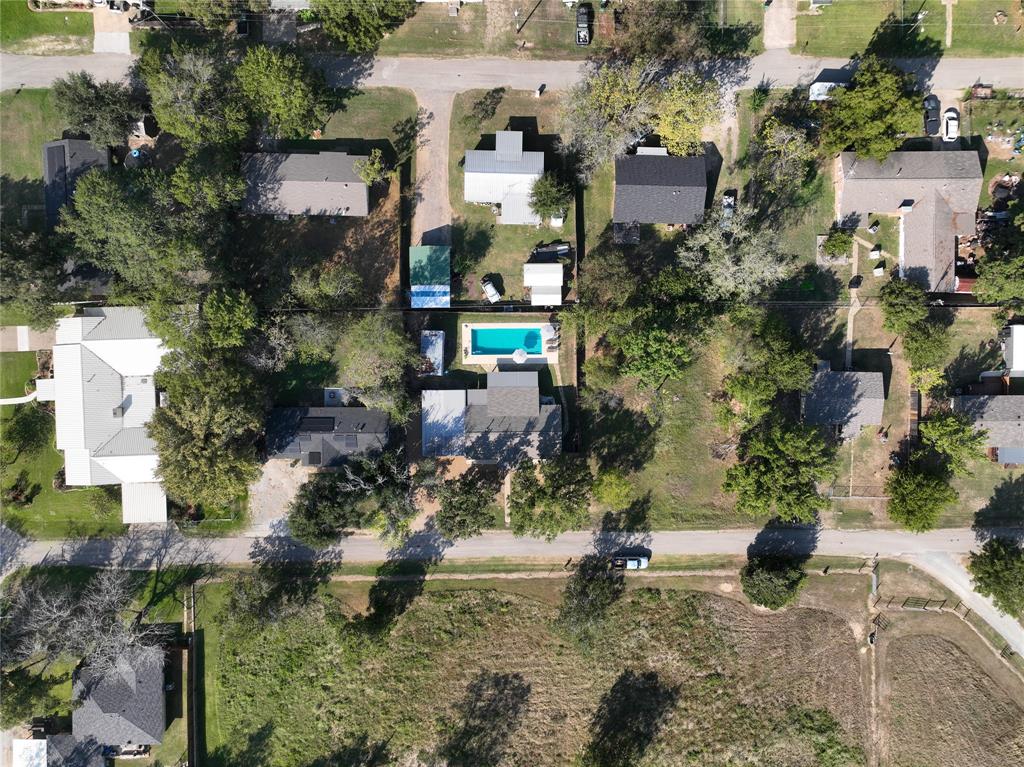 an aerial view of multi story residential apartment building with yard