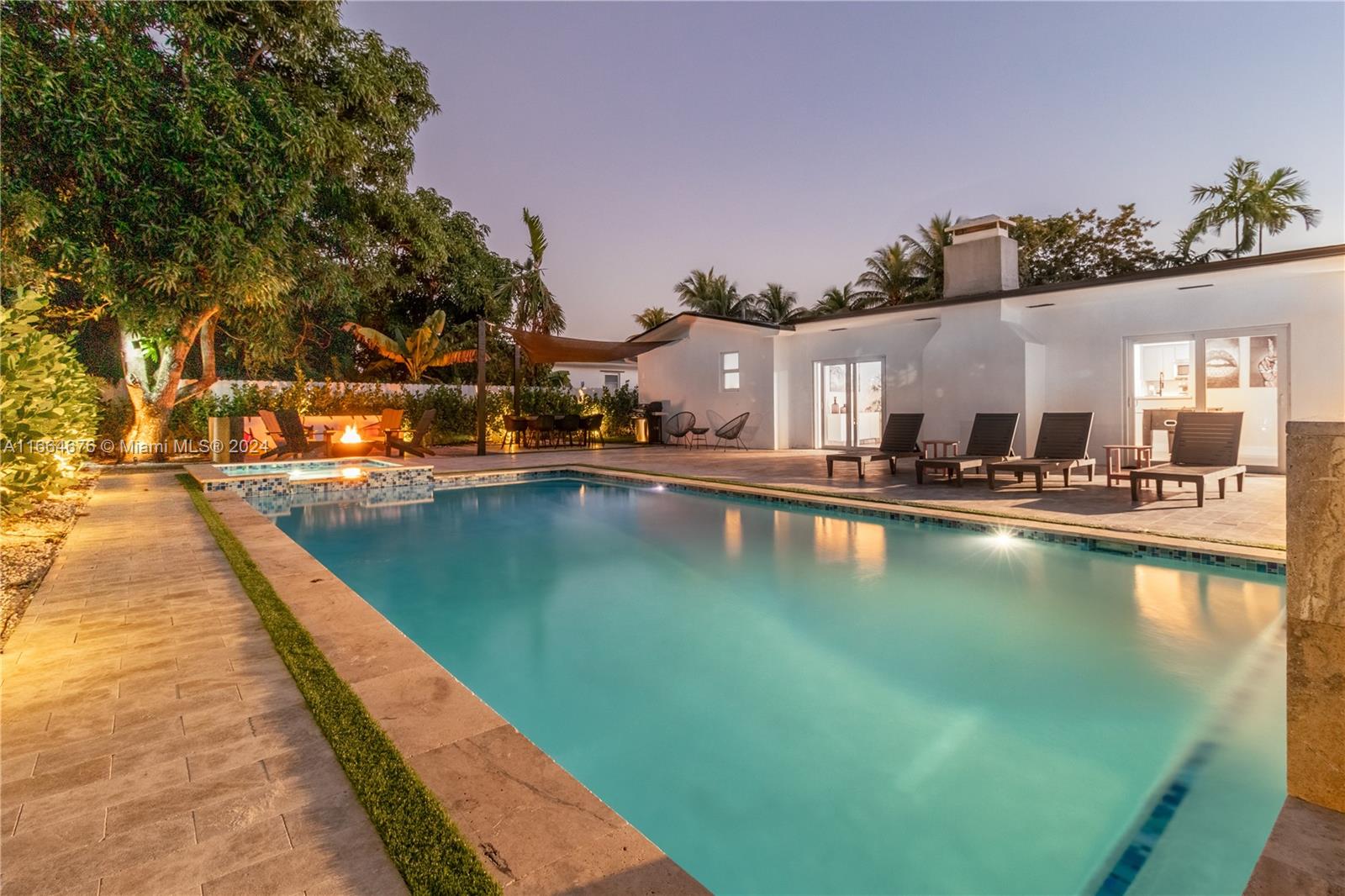 a view of a swimming pool with lounge chair