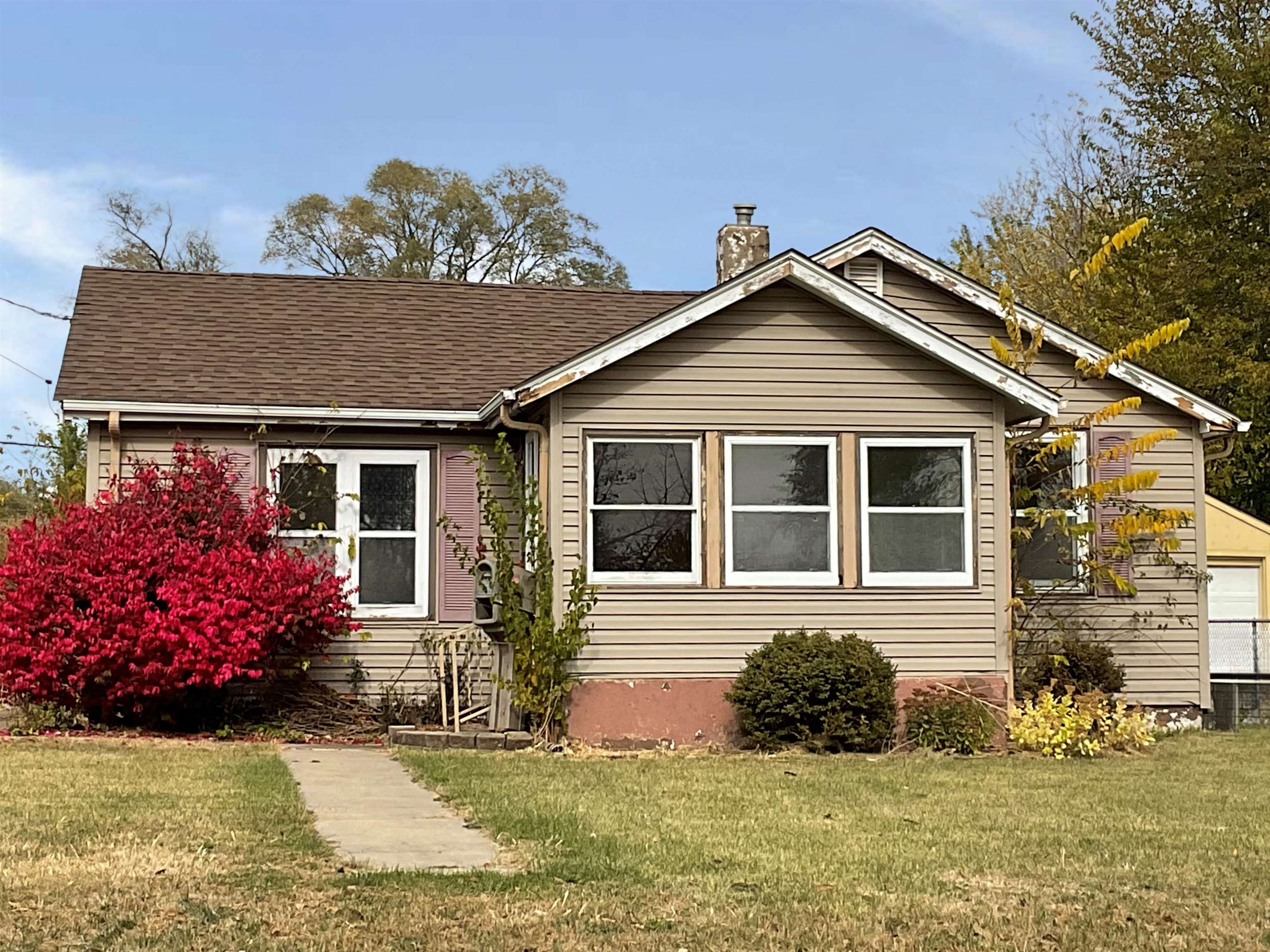 front view of a house with a yard