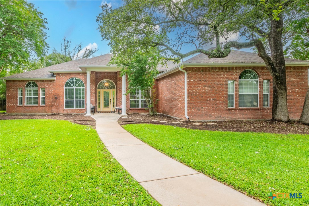 front view of a house with a yard