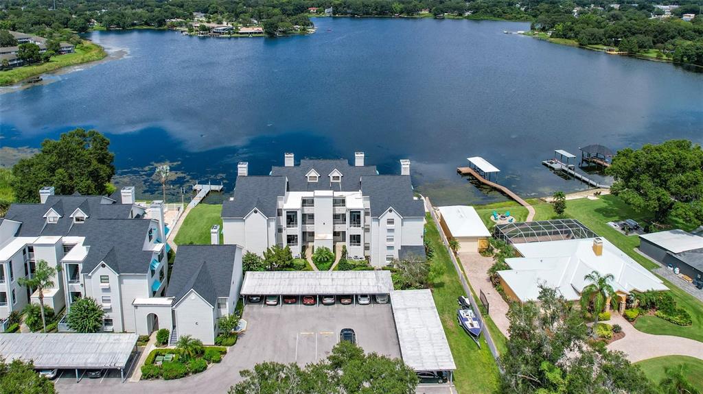 an aerial view of a house with outdoor space pool seating area and yard view