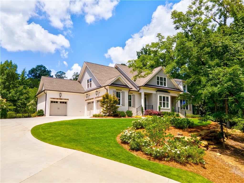 a front view of a house with a yard