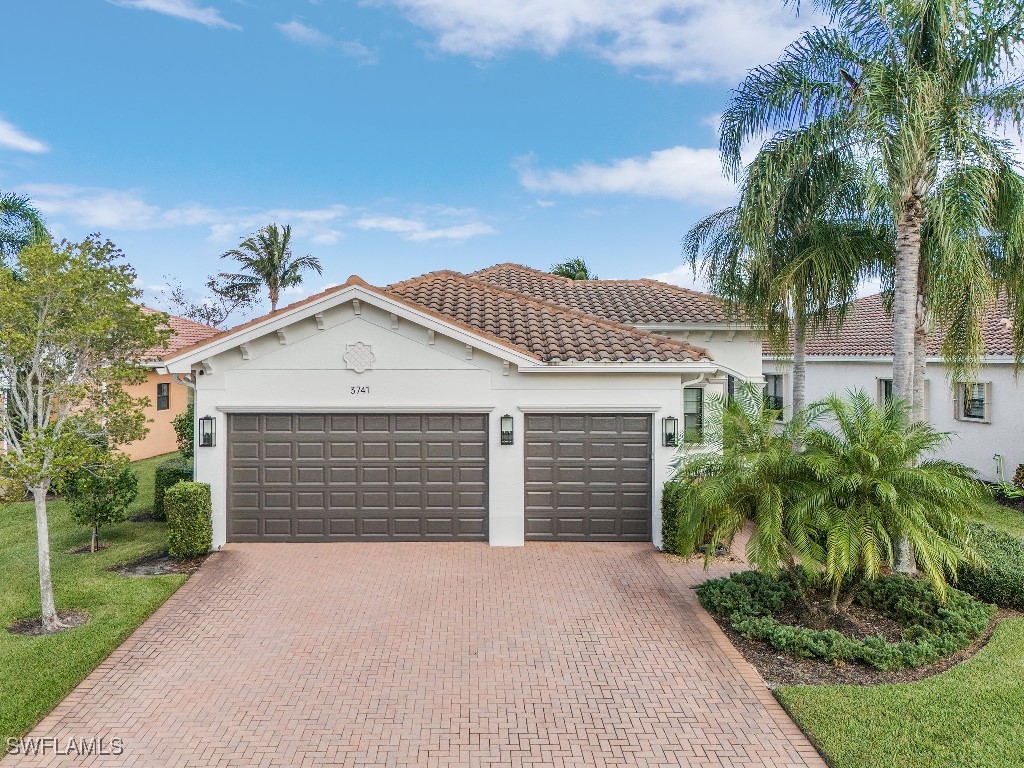 a front view of a house with a garage