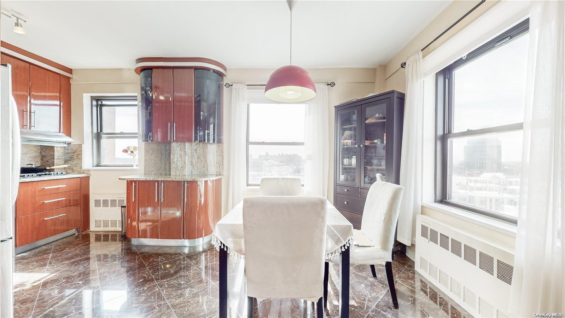 a view of a dining room with furniture window and outside view