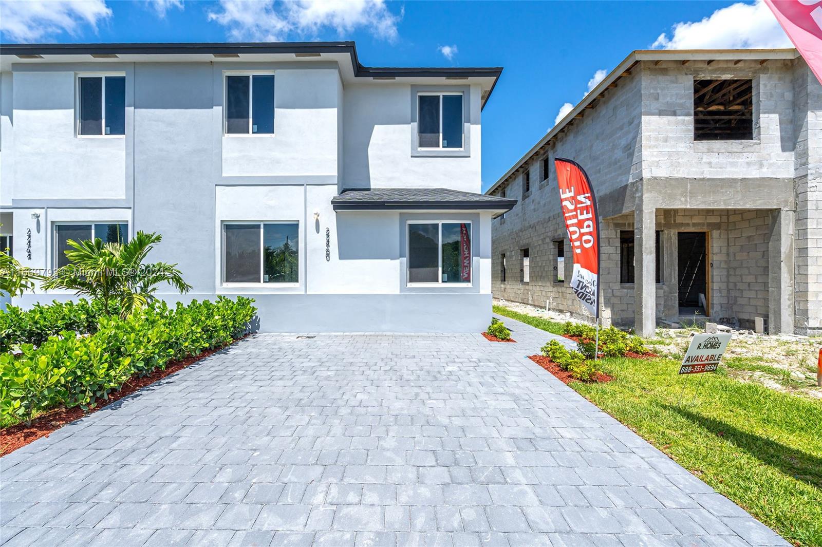 a view of house with swimming pool outdoor seating