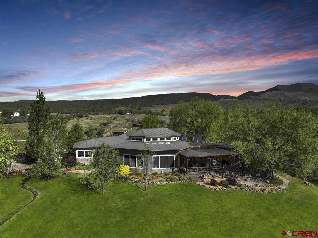 a view of a big house with a big yard