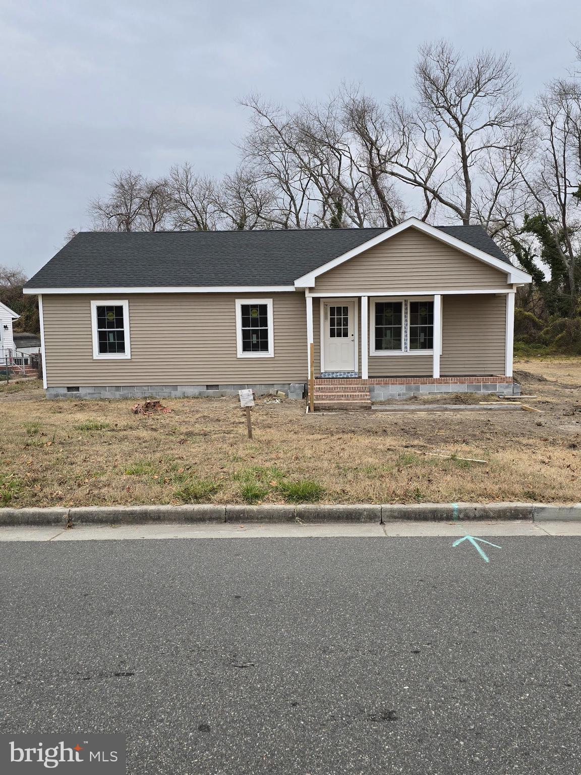 front view of a house with a yard