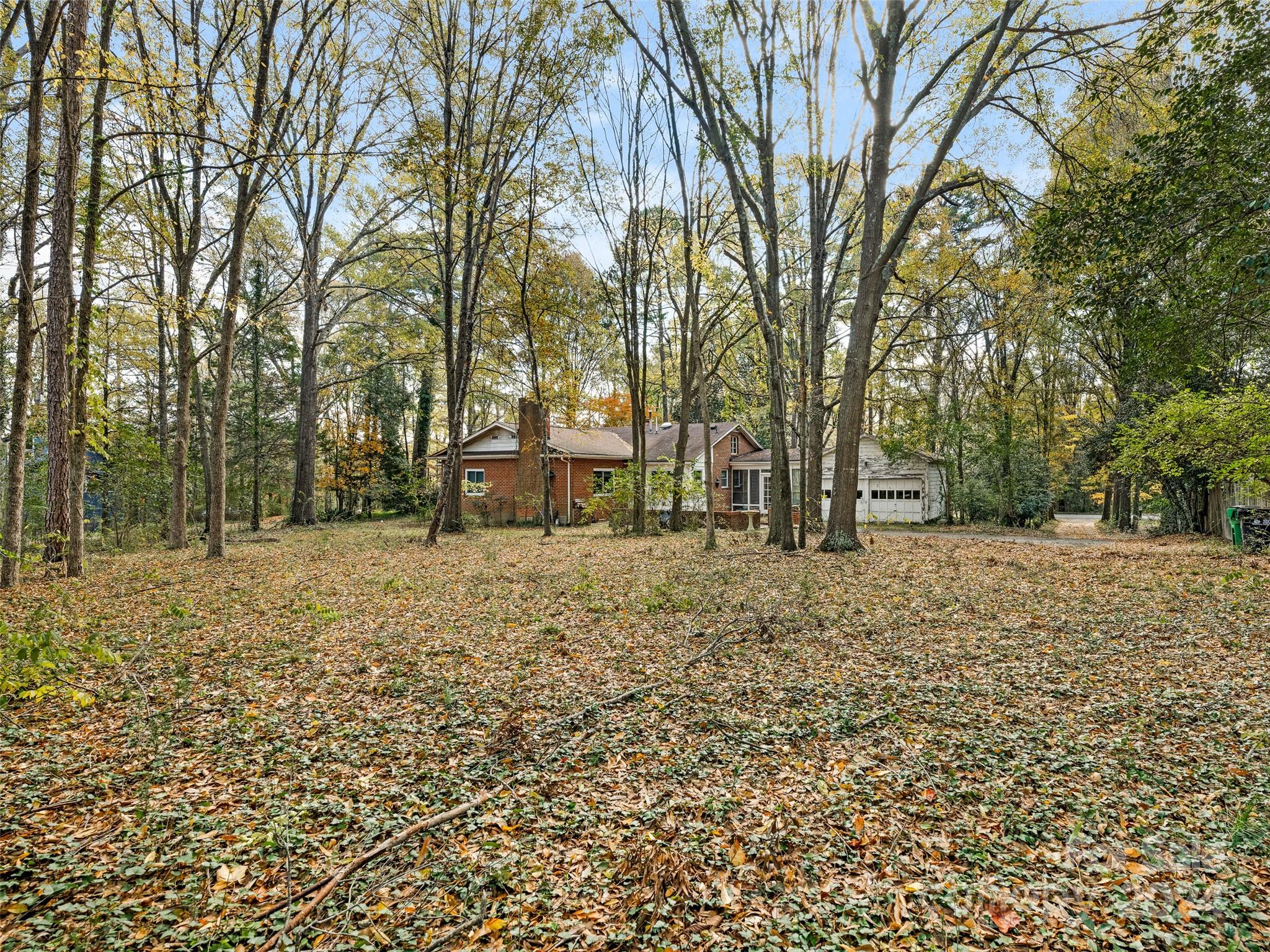 a backyard of a house with lots of green space