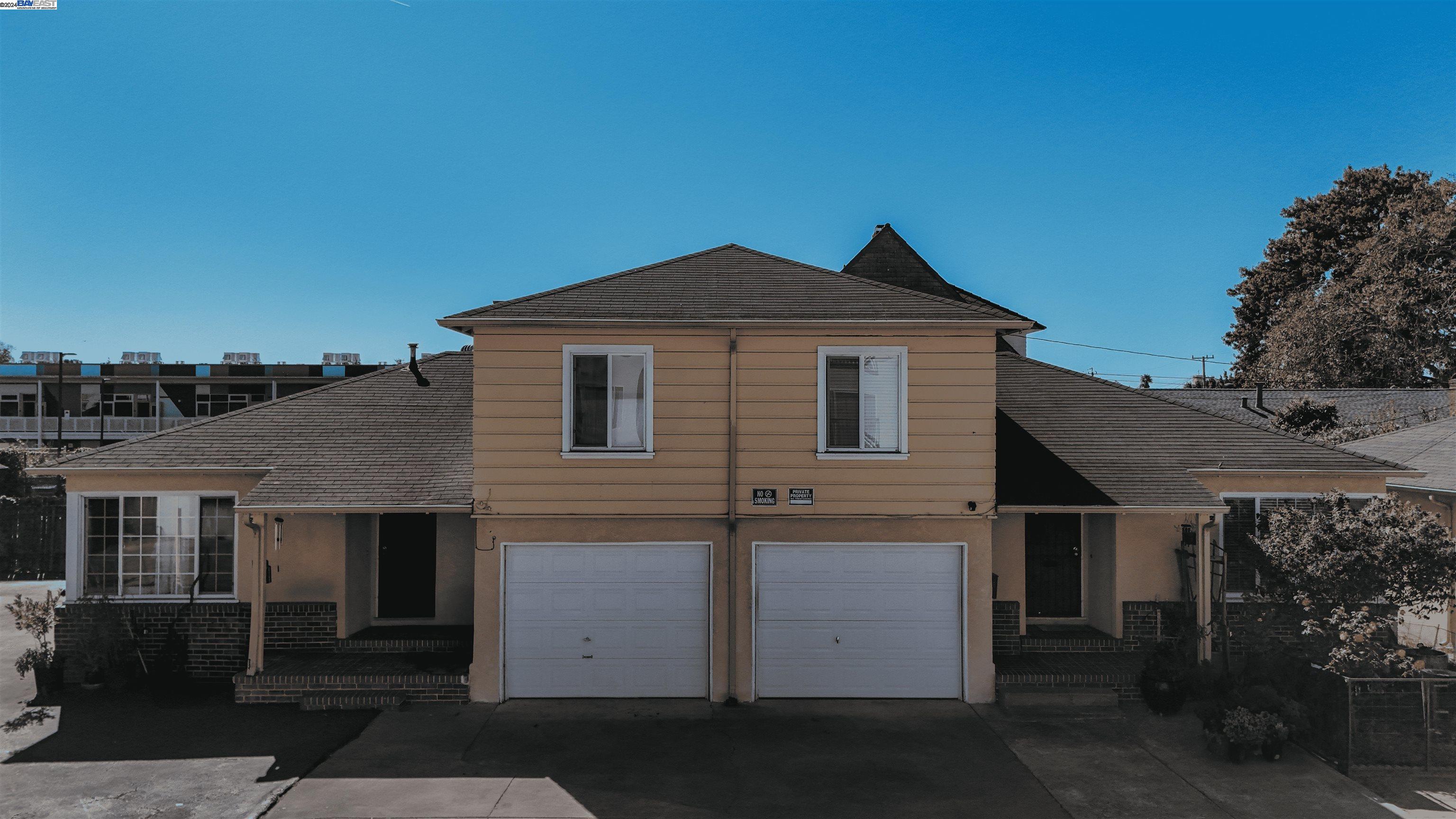 a front view of a house with a garage