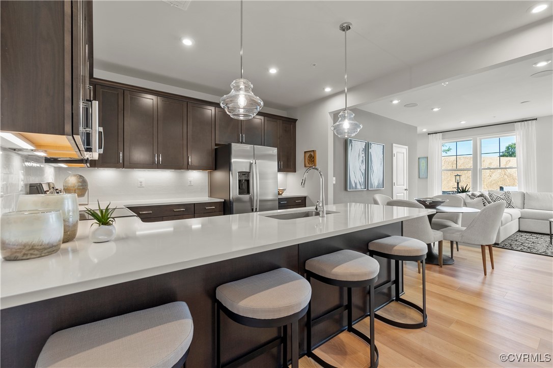 a kitchen with a table chairs stove and kitchen island